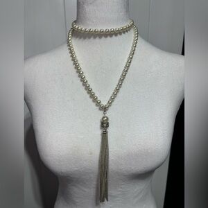 Long faux pearl necklace with large pearl, silver tone crystals and tassel